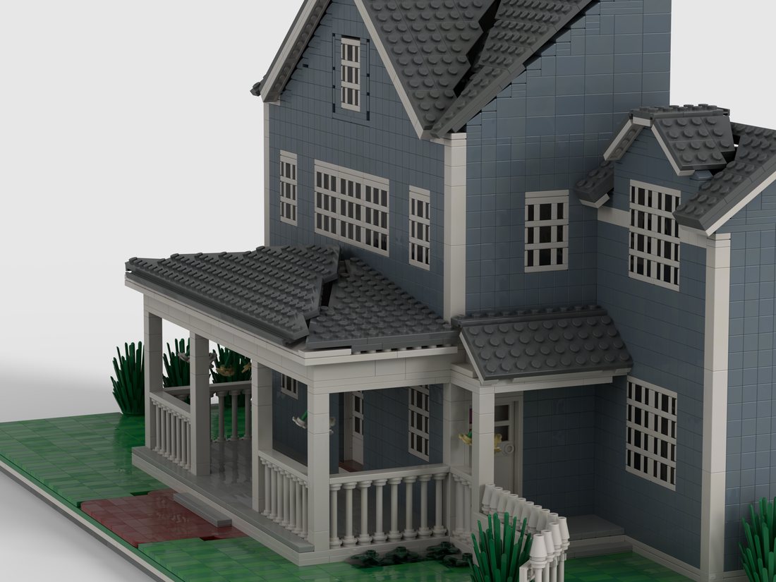 The finished model seen from the side, showing the depth of the porch and the stepped wings.